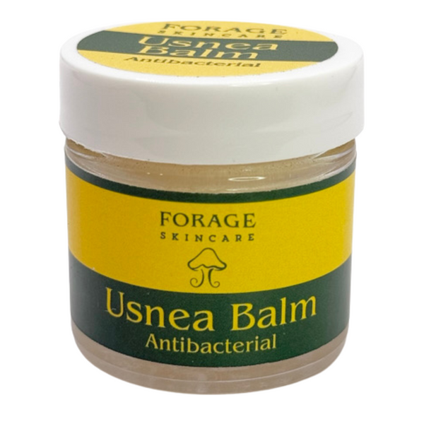 Jar of Forage Skincare Usnea Balm on a white background