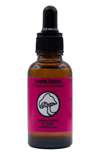 A dropper bottle labeled Tremella Tincture with a pink and white label, containing a mushroom extract. The bottle is amber-colored with a black dropper.